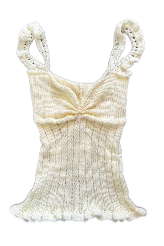 Cream-colored ribbed tank top with lace details on a white background